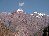 Manaslu 05 05 Lapuchun and Dwijen Himal Close Up From Deng From Deng (1800m), here is a close up of the impressive Lapuchun (5960 m) and Dwijen Himal (5521m) to the north on the Tibetan border. The Buri Gandaki valley turns from north-south to east-west and the route now crosses the main Himalayan range.